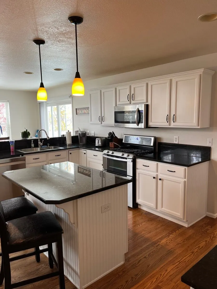 Denver kitchen cabinets after repainting by Kind Home Painting