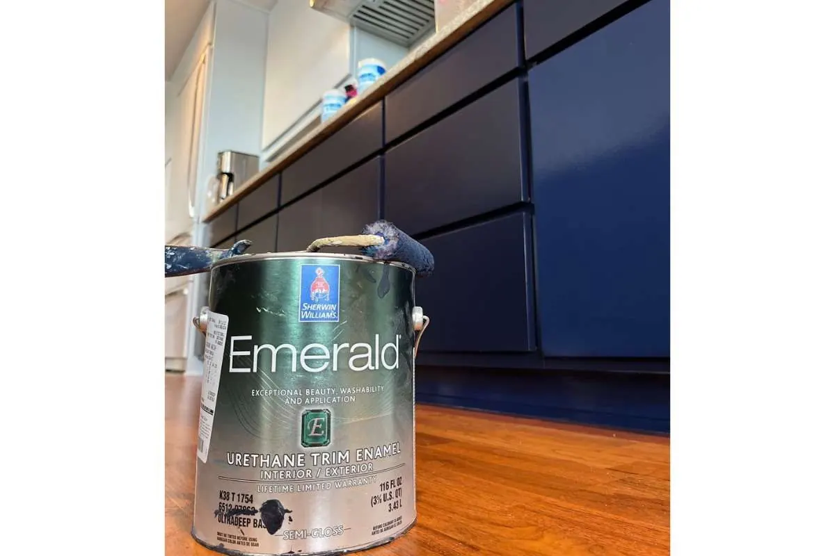 Sherwin-Williams Emerald urethane enamel in front of freshly painted navy cabinets