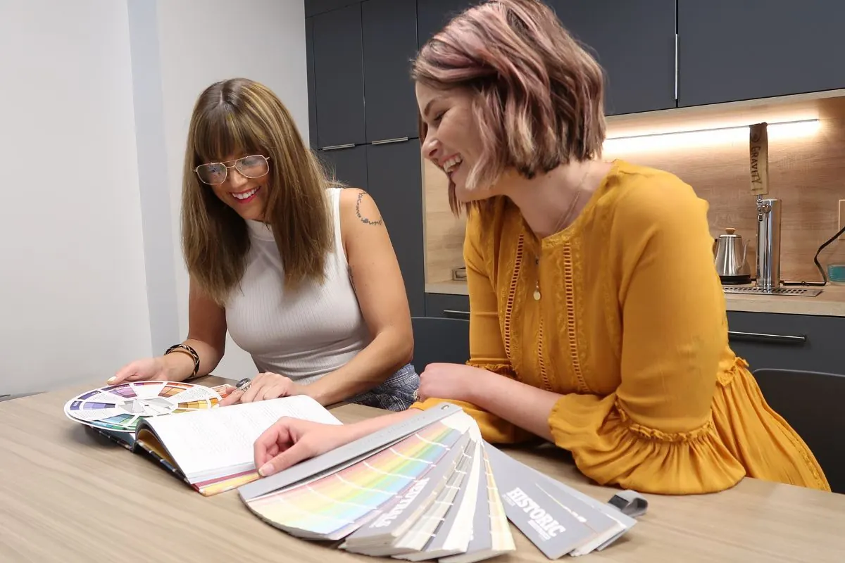 A Kind Home color consultant reviewing swatches with a client